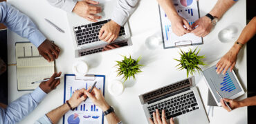 Hands of several employees during work