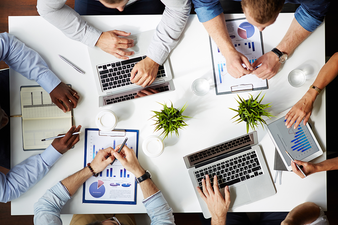 Hands of several employees during work